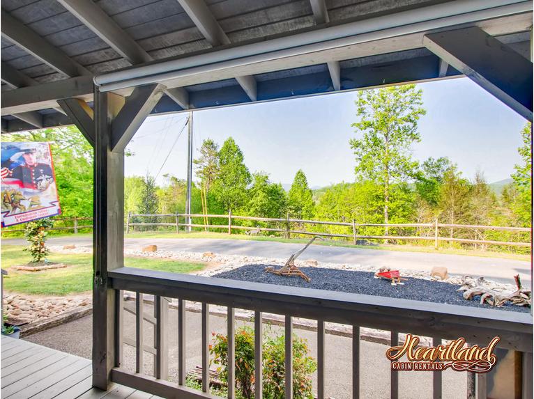 Front porch of this 1 bedroom honeymoon cabin near Pigeon Forge